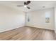 Bedroom featuring wood laminate floors and bright, natural light from two windows at 1908 Variations Ne Dr, Atlanta, GA 30329