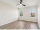 Well-lit bedroom showcasing wood-look floors, windows, and ample open space at 1908 Variations Ne Dr, Atlanta, GA 30329