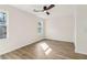 Light and airy bedroom with wood-look floors and a modern ceiling fan at 1908 Variations Ne Dr, Atlanta, GA 30329