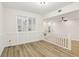Open-concept dining room with wainscoting, natural light and hardwood flooring at 1908 Variations Ne Dr, Atlanta, GA 30329