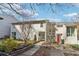 Inviting townhome featuring manicured landscaping, a concrete walkway, and a neutral color scheme at 1908 Variations Ne Dr, Atlanta, GA 30329