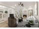 Bright living room with fireplace, ceiling fan, modern decor, and neutral color palette at 1908 Variations Ne Dr, Atlanta, GA 30329