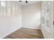 Bright sunroom featuring hardwood floors, natural light with window, and white door at 1908 Variations Ne Dr, Atlanta, GA 30329
