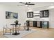 Chic bar area featuring modern cabinetry, stainless steel appliances, and sleek furnishings at 5060 Lake Forrest Dr, Atlanta, GA 30342