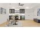 Stylish bar area with modern cabinets, appliances, and seating, great for entertaining guests at 5060 Lake Forrest Dr, Atlanta, GA 30342
