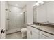 Bathroom featuring a glass shower and a white vanity with modern fixtures at 5060 Lake Forrest Dr, Atlanta, GA 30342