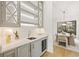 Butler's pantry with gray cabinets, quartz countertops, and a wine refrigerator at 5060 Lake Forrest Dr, Atlanta, GA 30342