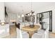 Open concept dining room and kitchen features a large marble island and a dining space at 5060 Lake Forrest Dr, Atlanta, GA 30342