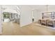 Bright open-concept entryway leading to the dining and living areas with light hardwood floors at 5060 Lake Forrest Dr, Atlanta, GA 30342