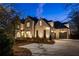 Stunning two-story brick home with a spacious driveway and attached two-car garage at 5060 Lake Forrest Dr, Atlanta, GA 30342