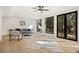 Bright living room with natural light, modern furniture, and views of the trees outside at 5060 Lake Forrest Dr, Atlanta, GA 30342