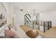 Upstairs living room with a comfortable sofa and railing overlooking the floor below at 5060 Lake Forrest Dr, Atlanta, GA 30342