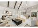 Spacious open-concept living room with white decor, a modern fireplace, and high vaulted ceilings at 5060 Lake Forrest Dr, Atlanta, GA 30342