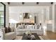 Open concept living room and kitchen with beamed ceiling, light-colored walls and hardwood floors at 5060 Lake Forrest Dr, Atlanta, GA 30342