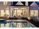 Covered patio with clear view into the home, seamlessly connecting indoor and outdoor living spaces by the pool at 5060 Lake Forrest Dr, Atlanta, GA 30342