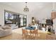 Bright room with a round table, custom storage, and a view to the outdoor pool area at 5060 Lake Forrest Dr, Atlanta, GA 30342