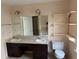 Bright bathroom featuring a double vanity, large mirror and decorative wall shelving at 6420 Phillips Pl, Lithonia, GA 30058