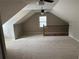 Bonus room featuring neutral carpet and a window at 6420 Phillips Pl, Lithonia, GA 30058