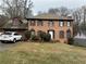 Charming two-story brick home featuring manicured landscaping and a classic architectural design at 6420 Phillips Pl, Lithonia, GA 30058
