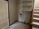 Mud room with tile floor, utility connections, and shelves at 6420 Phillips Pl, Lithonia, GA 30058