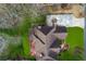 Aerial view of a home with well-manicured yard, red deck, mature trees, and large driveway at 2353 Habersham Sw Dr, Marietta, GA 30064