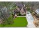 Aerial view of an elegant brick home on a landscaped lot with a circular driveway at 2353 Habersham Sw Dr, Marietta, GA 30064