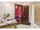 Stylish bathroom with a vessel sink, decorative countertop, and an adjacent shower area at 2353 Habersham Sw Dr, Marietta, GA 30064