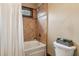 Cozy bathroom featuring a tub and shower combo with a decorative tile accent at 2353 Habersham Sw Dr, Marietta, GA 30064