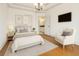 Bright bedroom with hardwood floors and an ensuite bathroom at 2353 Habersham Sw Dr, Marietta, GA 30064