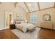 Relaxing bedroom boasting light-colored walls, high ceilings, and elegant decor and an attached bathroom at 2353 Habersham Sw Dr, Marietta, GA 30064
