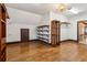 Large walk-in closet with hardwood floors, storage shelves, and hanging rods at 2353 Habersham Sw Dr, Marietta, GA 30064