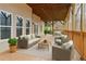 Inviting covered patio with comfortable outdoor seating and a relaxing view of nature at 2353 Habersham Sw Dr, Marietta, GA 30064