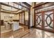 Open concept dining room adjacent to the foyer has stylish lighting and wood floors at 2353 Habersham Sw Dr, Marietta, GA 30064