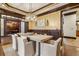 Elegant dining room featuring designer lighting, wainscoting, and hardwood floors adjacent to office at 2353 Habersham Sw Dr, Marietta, GA 30064