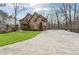 Brick home with circular window and a driveway at 2353 Habersham Sw Dr, Marietta, GA 30064