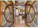 Grand foyer featuring custom front doors, gleaming hardwood floors, and an elegant staircase to the second story at 2353 Habersham Sw Dr, Marietta, GA 30064