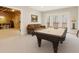 Finished game room with a billiards table, cozy seating, and a walkout to the outdoor scenery at 2353 Habersham Sw Dr, Marietta, GA 30064