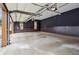 Spacious garage with painted walls and high ceilings providing ample parking and storage space at 2353 Habersham Sw Dr, Marietta, GA 30064