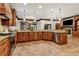 Spacious kitchen features custom wood cabinets, granite countertops, and modern stainless steel appliances at 2353 Habersham Sw Dr, Marietta, GA 30064