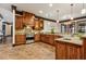 Spacious kitchen with custom wood cabinetry, stone countertops, and brick floors at 2353 Habersham Sw Dr, Marietta, GA 30064