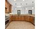 Kitchen boasting beautiful wood cabinets, granite countertops, and modern pendant lighting at 2353 Habersham Sw Dr, Marietta, GA 30064