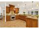 Spacious kitchen featuring custom wood cabinetry, granite countertops, and stainless steel appliances at 2353 Habersham Sw Dr, Marietta, GA 30064