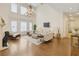Bright and airy living room with a soaring ceiling, hardwood floors, and a stunning chandelier at 2353 Habersham Sw Dr, Marietta, GA 30064