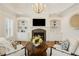 Cozy living room features a fireplace with built-in shelving and white furniture at 2353 Habersham Sw Dr, Marietta, GA 30064
