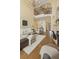 Comfortable living room featuring hardwood floors, a fireplace, and a view of the second-floor landing at 2353 Habersham Sw Dr, Marietta, GA 30064