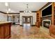 Open living room with wood flooring, fireplace, and seamlessly connecting the living area to the kitchen at 2353 Habersham Sw Dr, Marietta, GA 30064