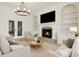 Bright living room with fireplace, built-in shelving, and neutral tones at 2353 Habersham Sw Dr, Marietta, GA 30064
