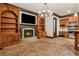 Cozy living room featuring a fireplace, built-in bookshelves, and brick floors at 2353 Habersham Sw Dr, Marietta, GA 30064
