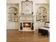 Inviting living room features a cozy fireplace flanked by custom built-ins and elegant decor at 2353 Habersham Sw Dr, Marietta, GA 30064
