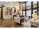 Charming living room with a fireplace, built-in shelves, hardwood floors, and a chandelier at 2353 Habersham Sw Dr, Marietta, GA 30064